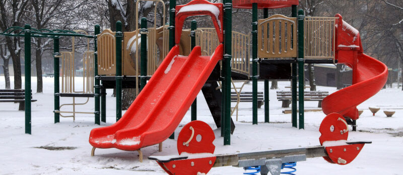 Winter Playground Children's playground in falling snow